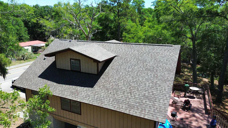 Completed CertainTeed Landmark architectural shingle roof in warm taupe-gray on the same Hilton Head Island home