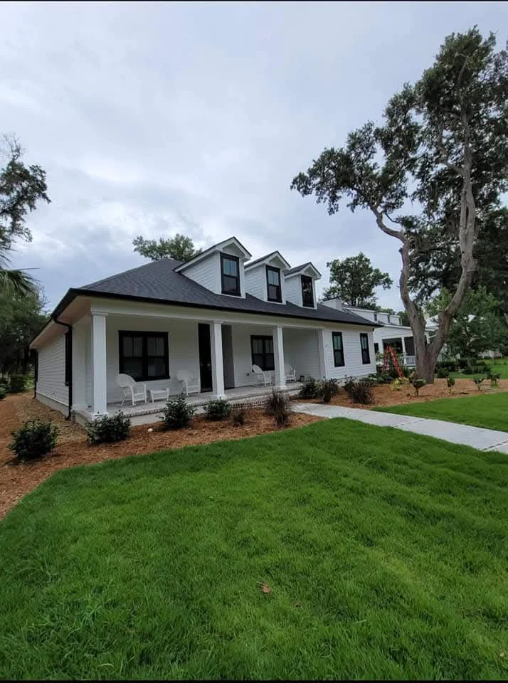Full elevation of custom black seamless gutters installed on a Beaufort, South Carolina home