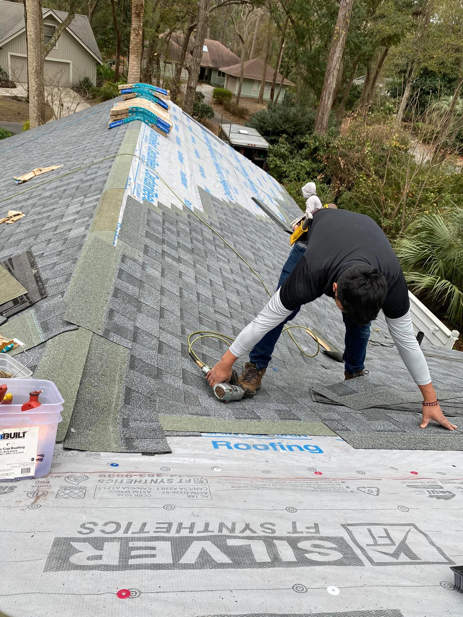 JJ Roofing installer nailing CertainTeed Landmark architectural shingles over synthetic underlayment