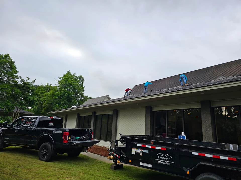 JJ Roofing crew on site with the company trailer following a two-story coastal re-roof in Hilton Head Plantation, South Carolina